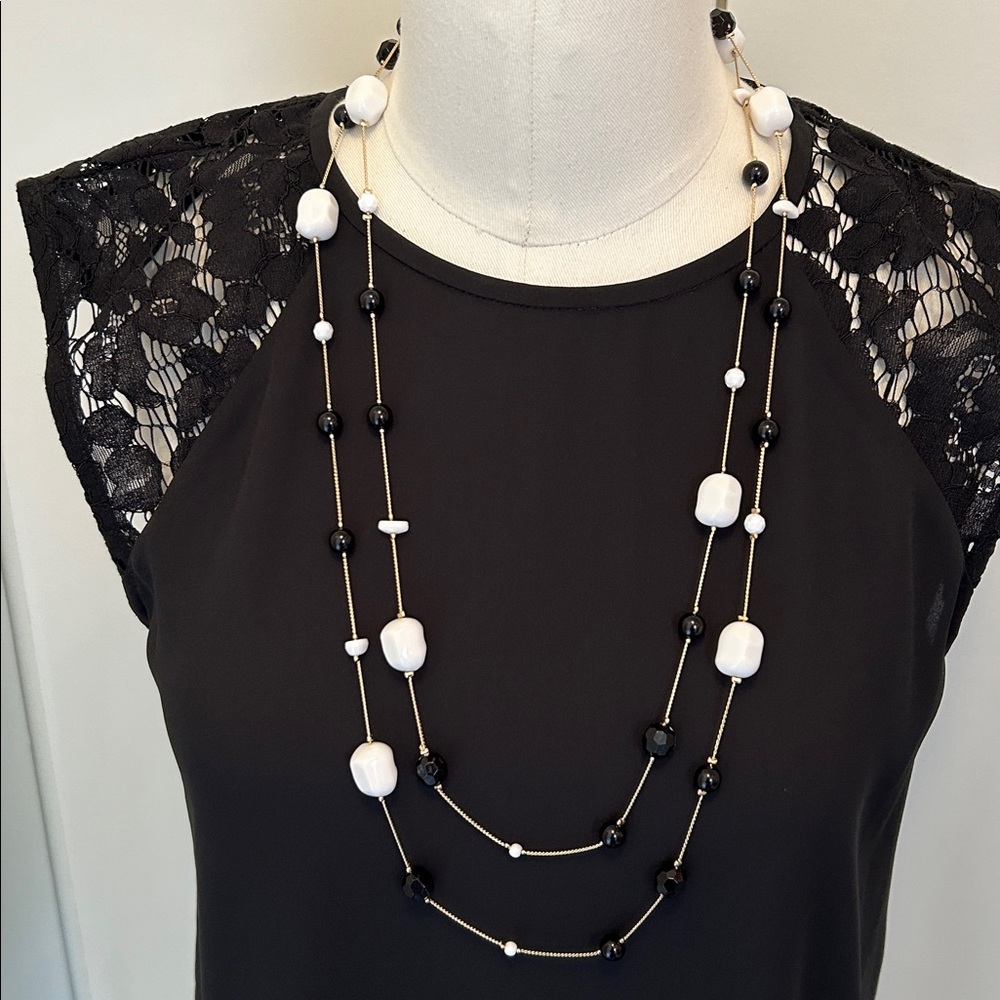 Fashion Jewelry Black and White Long Beaded Necklace on gold chain.